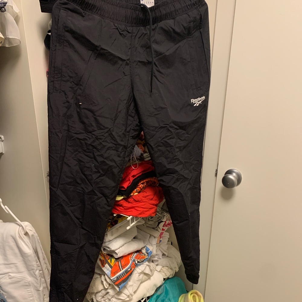 Black Reebok track pants with tag